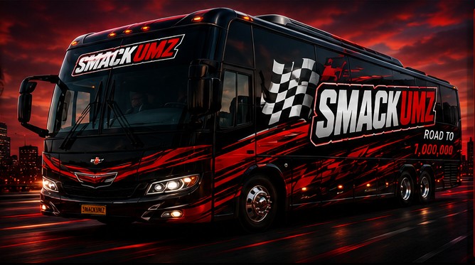 Official SMACKUMZ Road to 1,000,000 tour bus at night under red city lights
