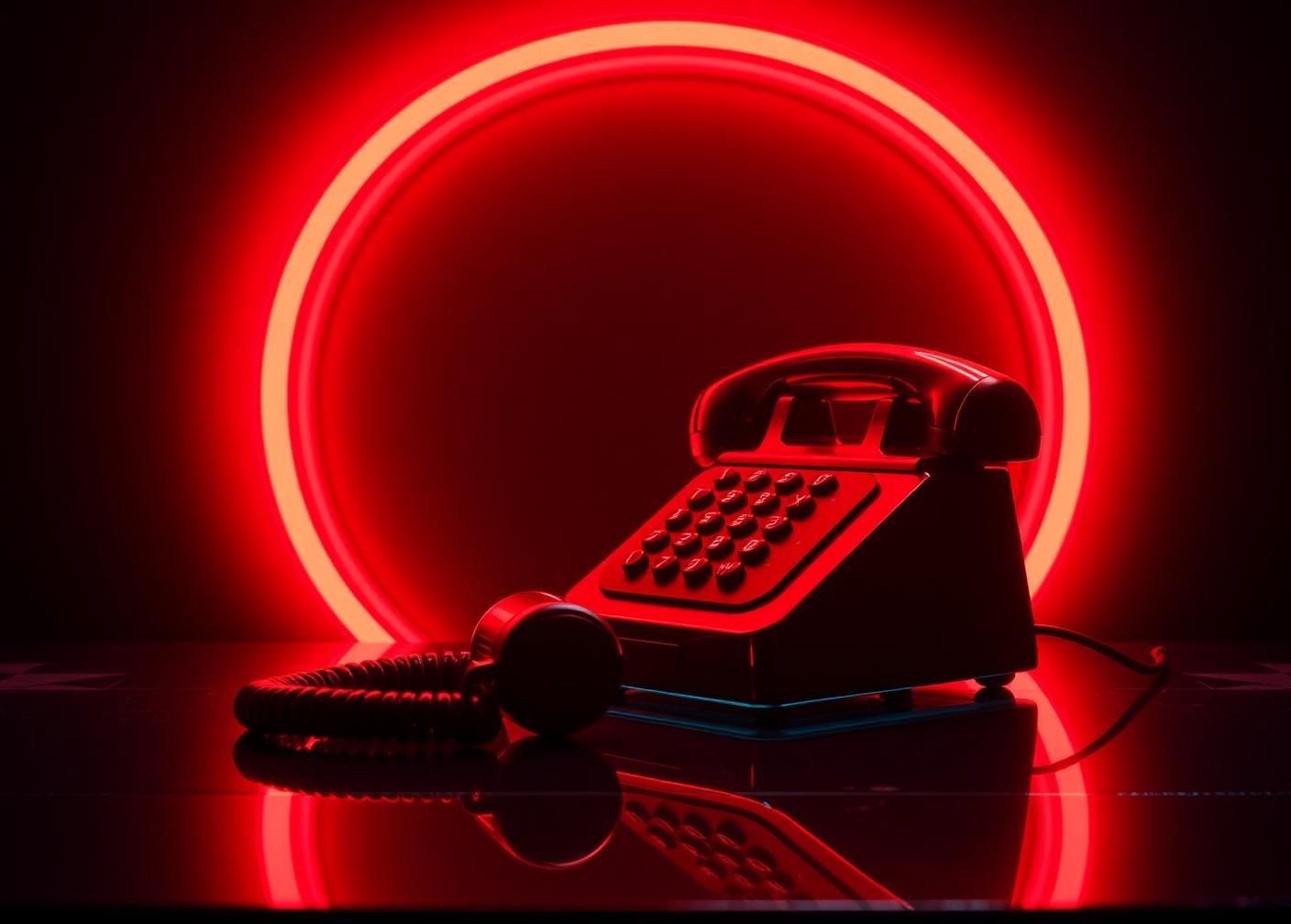 Glowing red SMACKUMZ hotline telephone